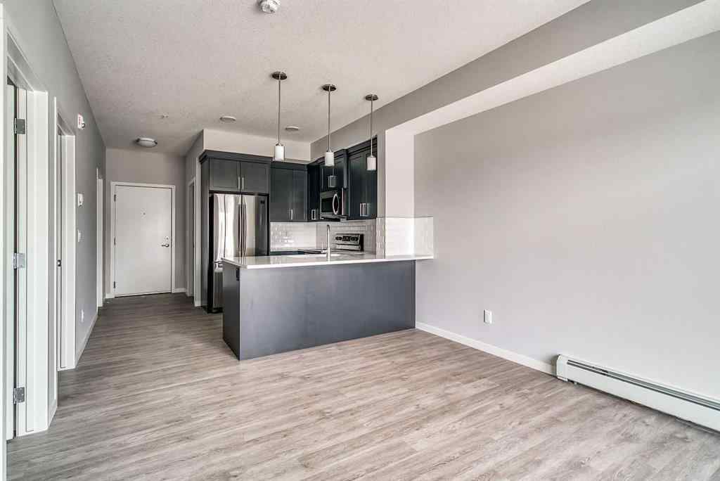 MLS® A2247917 - Unit #215 300 Harvest Hills Place NE in Harvest Hills Calgary, Residential