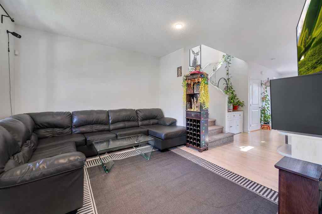 MLS® A2248211 - 239 Sundown Road  in Sunset Ridge Cochrane, Residential