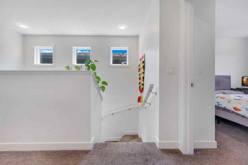 MLS® A2248211 - 239 Sundown Road  in Sunset Ridge Cochrane, Residential