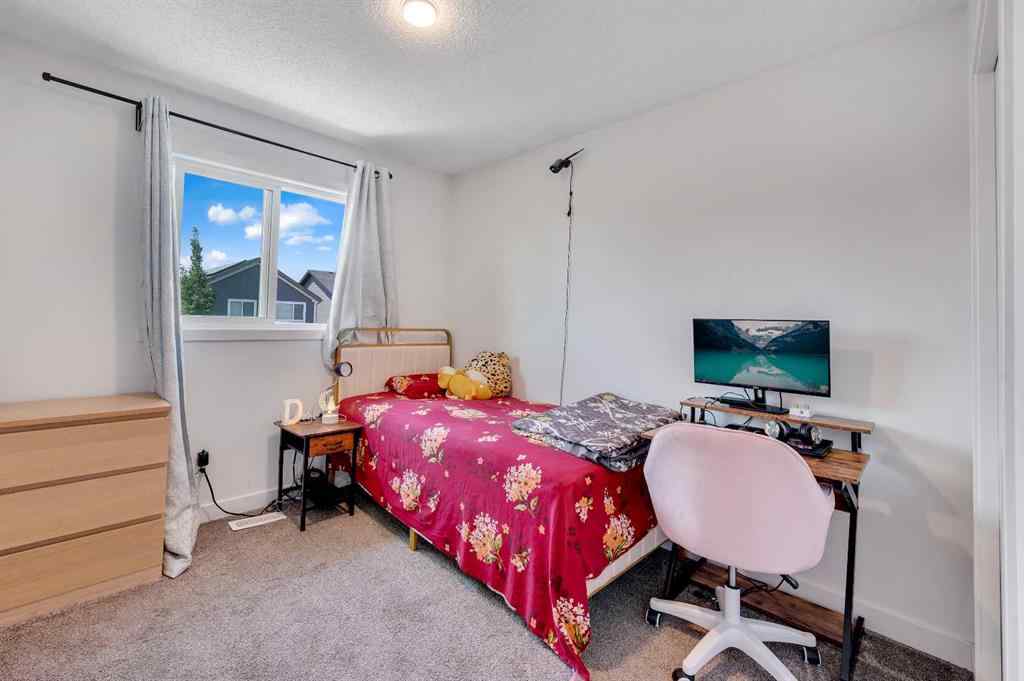 MLS® A2248211 - 239 Sundown Road  in Sunset Ridge Cochrane, Residential