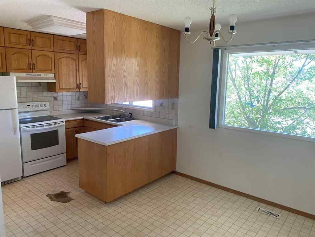 MLS® A2248322 - 9812 83 Avenue  in Patterson Place Grande Prairie, Residential
