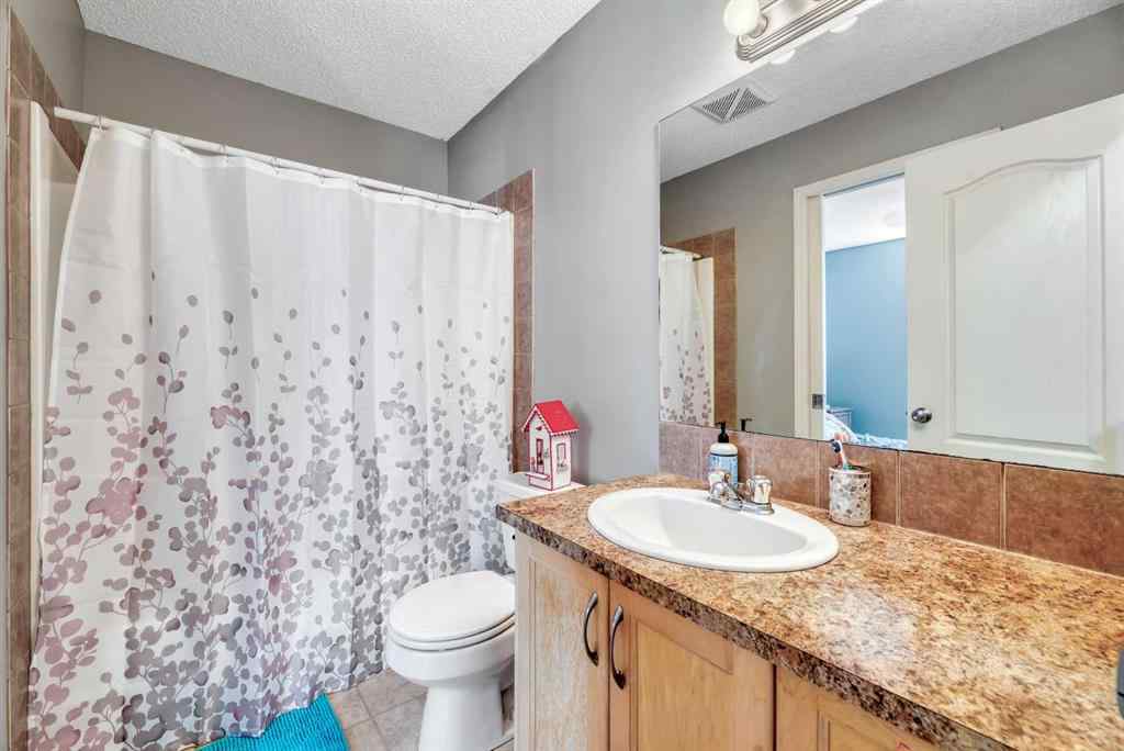MLS® A2248377 - 205 Strathaven Mews  in Strathaven Strathmore, Residential
