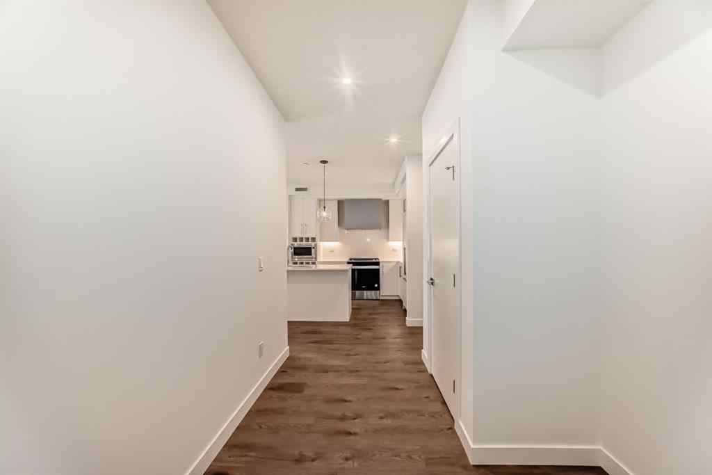 MLS® A2248724 - Unit #205 8370 Broadcast Avenue SW in West Springs Calgary, Residential
