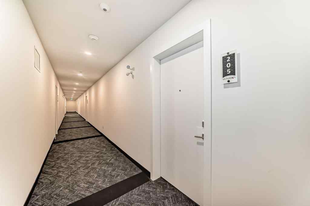 MLS® A2248724 - Unit #205 8370 Broadcast Avenue SW in West Springs Calgary, Residential