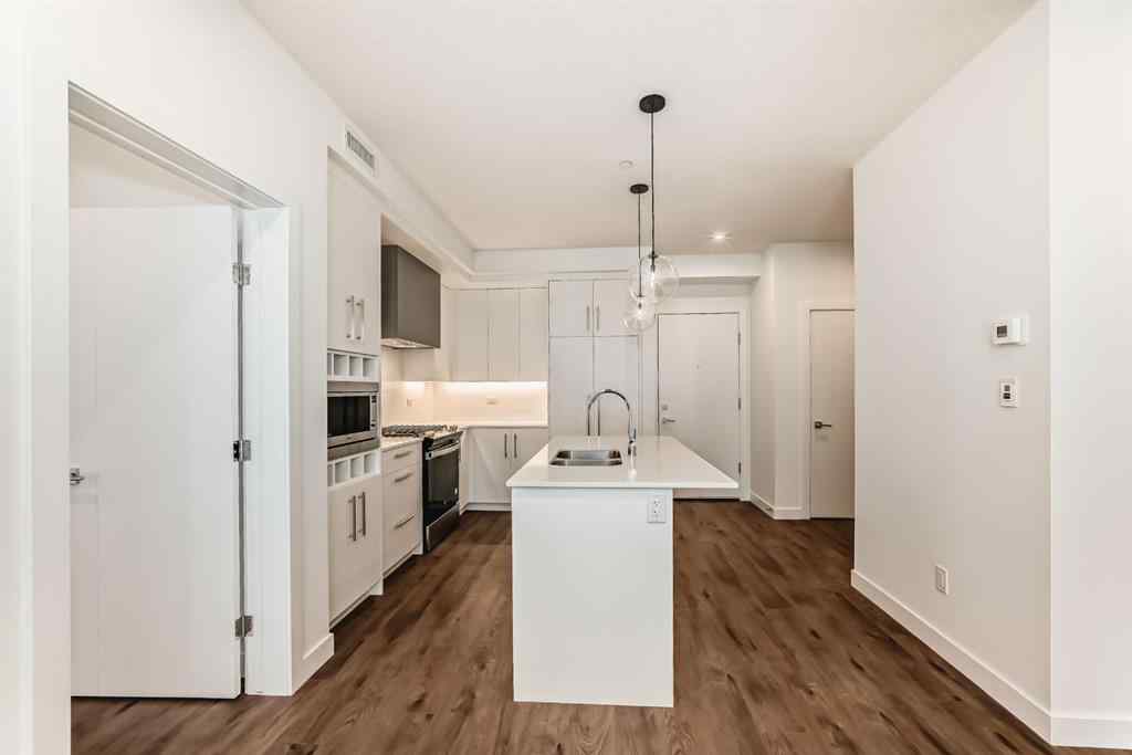MLS® A2248724 - Unit #205 8370 Broadcast Avenue SW in West Springs Calgary, Residential