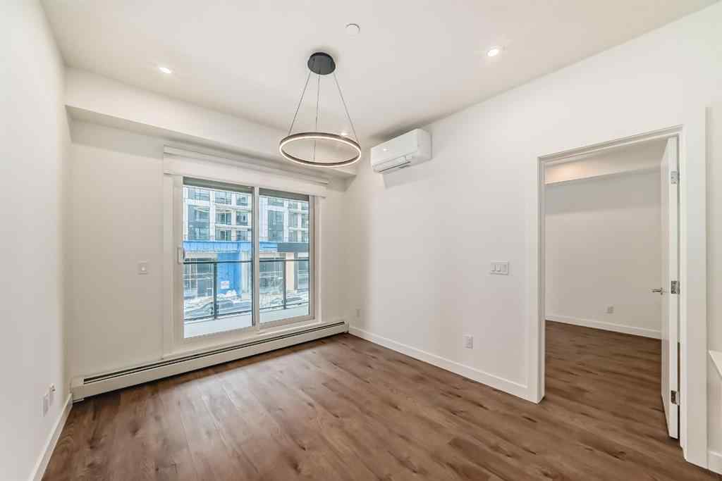 MLS® A2248724 - Unit #205 8370 Broadcast Avenue SW in West Springs Calgary, Residential