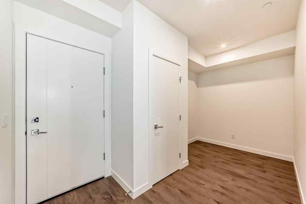 MLS® A2248724 - Unit #205 8370 Broadcast Avenue SW in West Springs Calgary, Residential