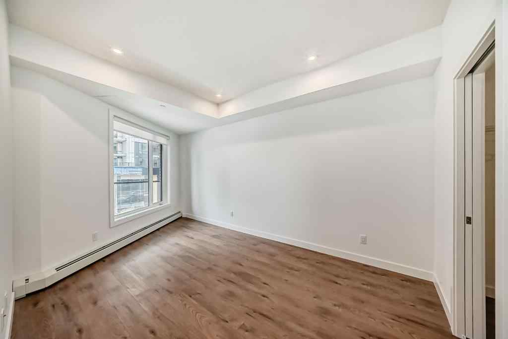 MLS® A2248724 - Unit #205 8370 Broadcast Avenue SW in West Springs Calgary, Residential