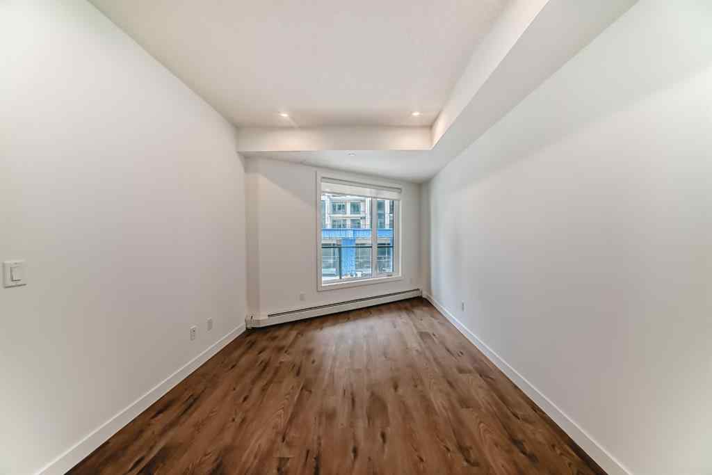 MLS® A2248724 - Unit #205 8370 Broadcast Avenue SW in West Springs Calgary, Residential