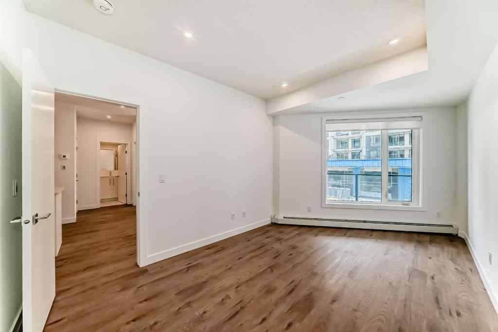MLS® A2248724 - Unit #205 8370 Broadcast Avenue SW in West Springs Calgary, Residential