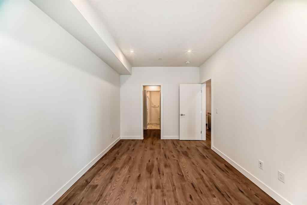 MLS® A2248724 - Unit #205 8370 Broadcast Avenue SW in West Springs Calgary, Residential