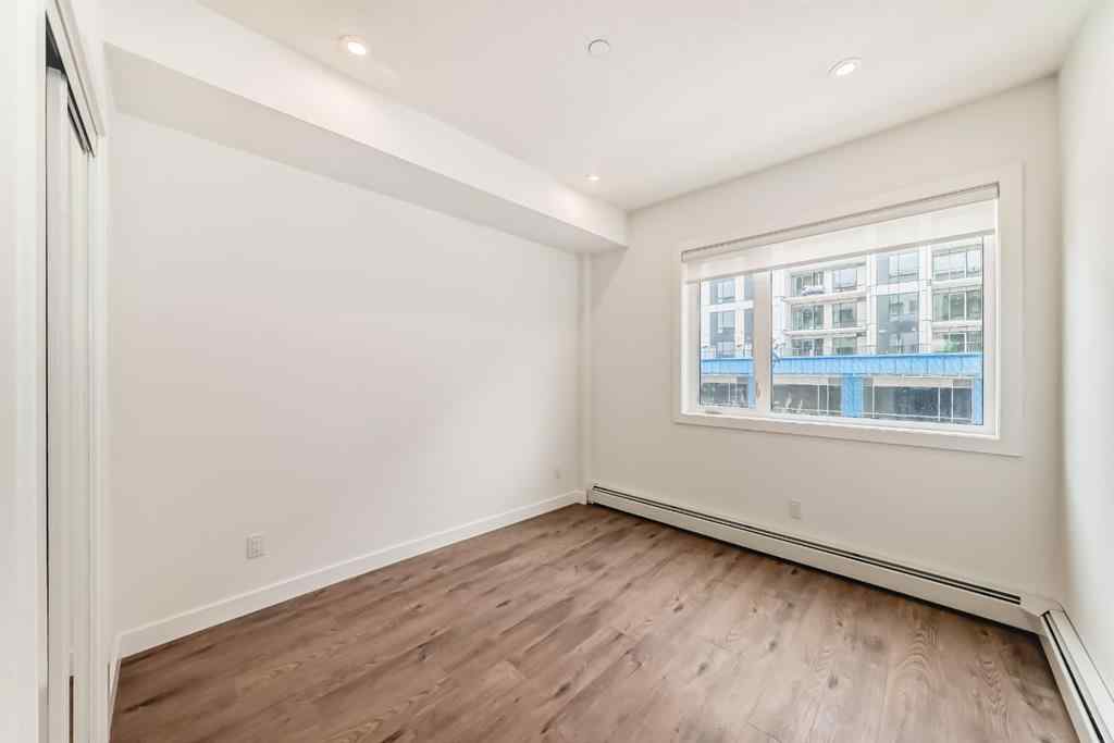 MLS® A2248724 - Unit #205 8370 Broadcast Avenue SW in West Springs Calgary, Residential