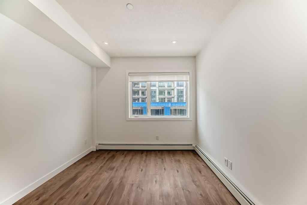 MLS® A2248724 - Unit #205 8370 Broadcast Avenue SW in West Springs Calgary, Residential