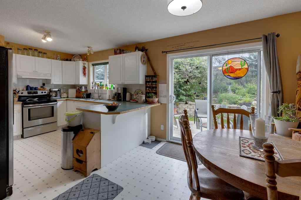 MLS® A2248776 - 234 Quigley Drive  in West Terrace Cochrane, Residential