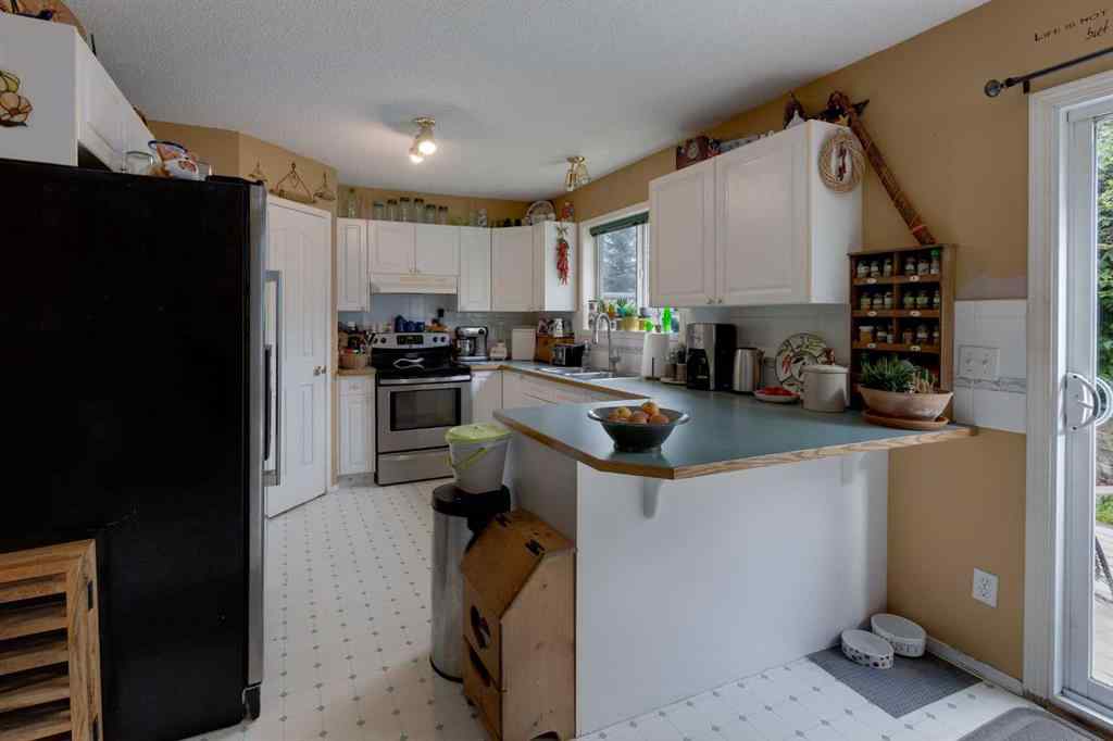MLS® A2248776 - 234 Quigley Drive  in West Terrace Cochrane, Residential