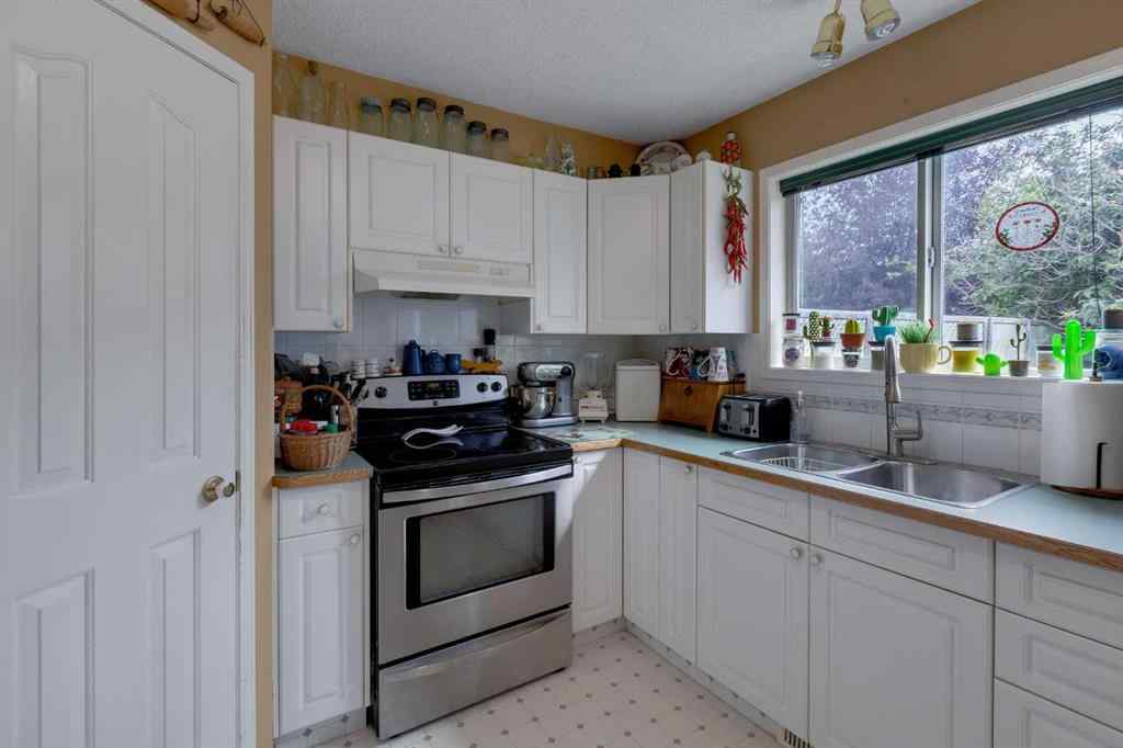 MLS® A2248776 - 234 Quigley Drive  in West Terrace Cochrane, Residential