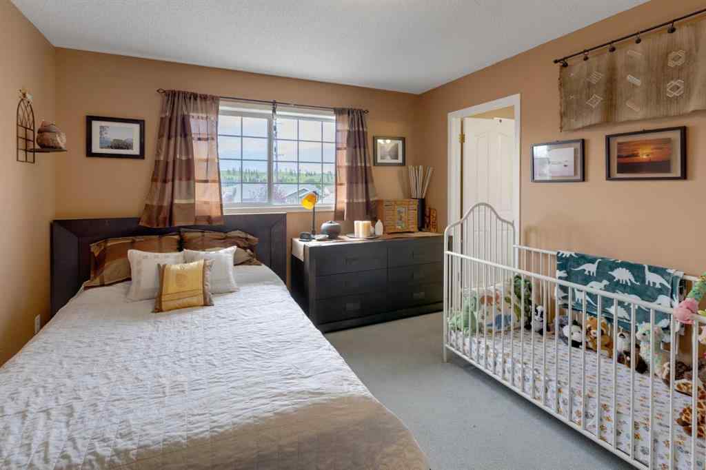 MLS® A2248776 - 234 Quigley Drive  in West Terrace Cochrane, Residential