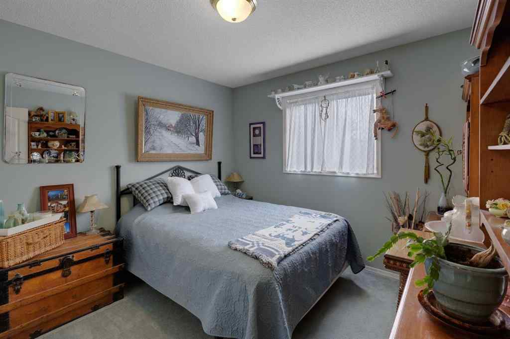 MLS® A2248776 - 234 Quigley Drive  in West Terrace Cochrane, Residential