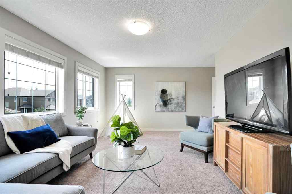 MLS® A2248821 - 107 Everhollow Street SW in Evergreen Calgary, Residential