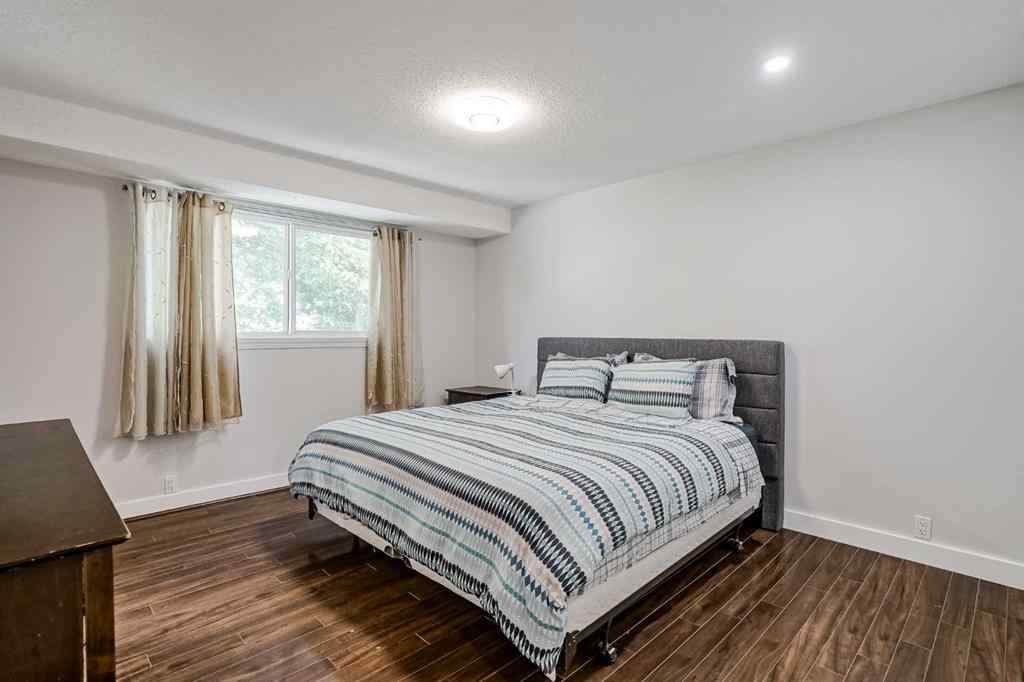 MLS® A2248857 - 208 Woodpark Place SW in Woodlands Calgary, Residential