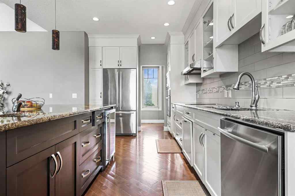MLS® A2249022 - 22 Wendham Place SW in West Springs Calgary, Residential