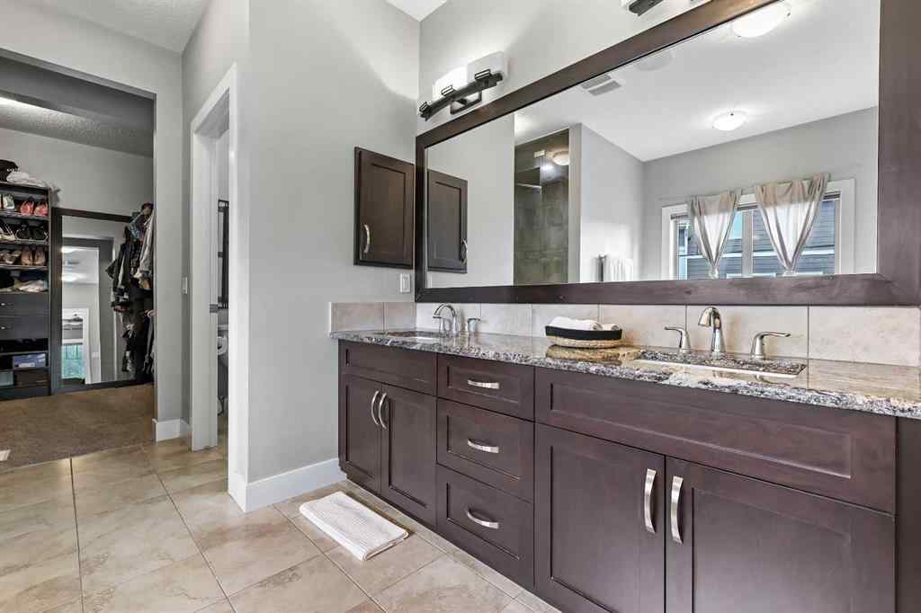 MLS® A2249022 - 22 Wendham Place SW in West Springs Calgary, Residential