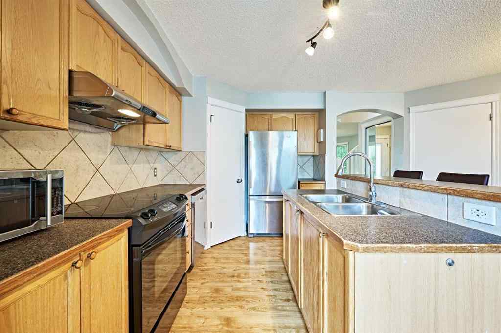 MLS® A2249220 - 145 Tuscany Springs Way NW in Tuscany Calgary, Residential