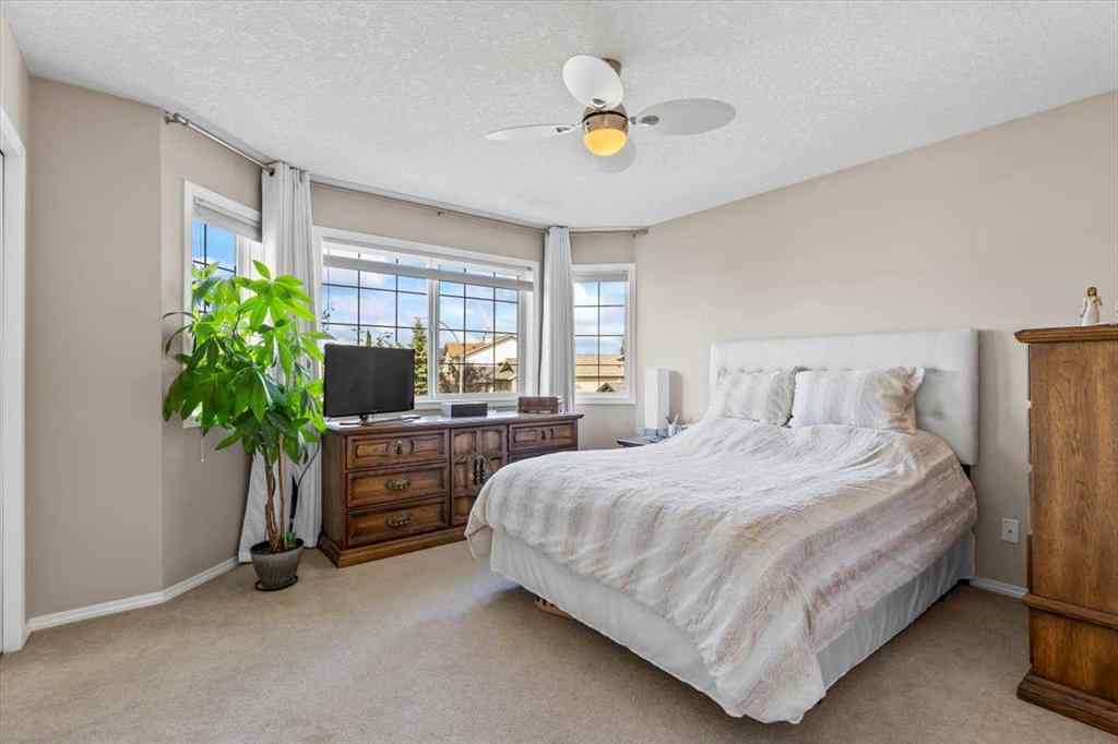 MLS® A2249264 - 140 Eversyde Circle SW in Evergreen Calgary, Residential