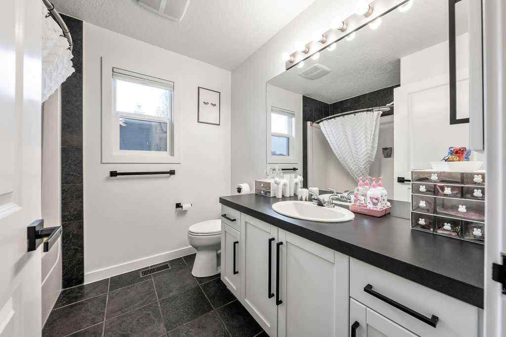 MLS® A2249266 - 703 Boulder Creek Drive SE in Boulder Creek Estates Langdon, Residential