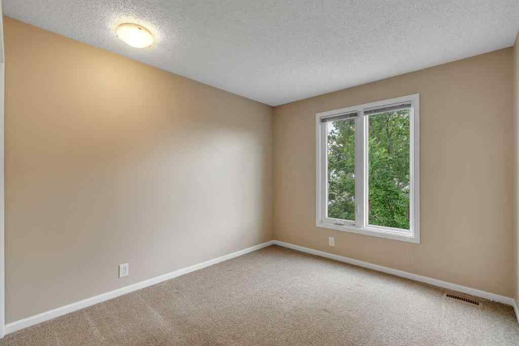 MLS® A2249410 - 22 Coachway Green SW in Coach Hill Calgary, Residential