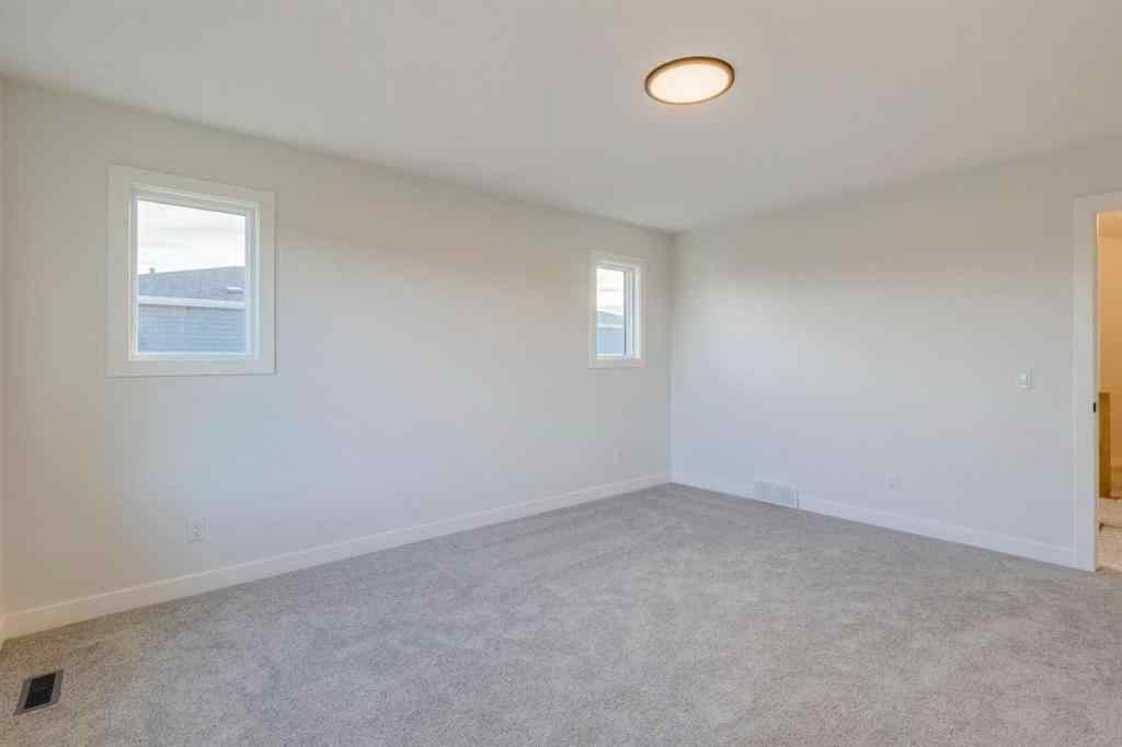 MLS® A2249603 - 54 Amblefield Common NW in Moraine Calgary, Residential