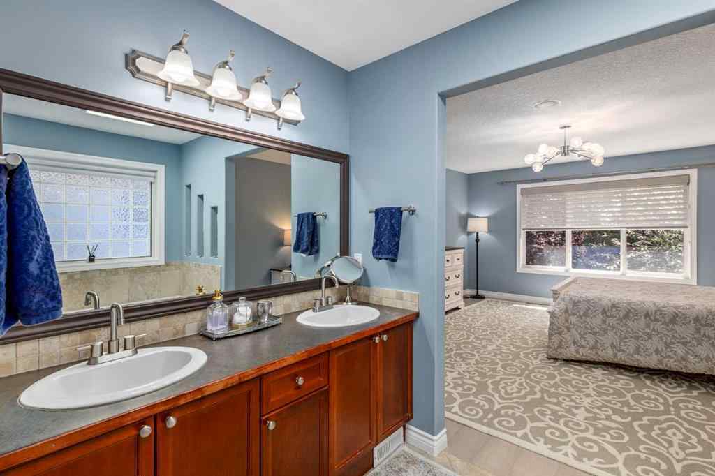 MLS® A2249604 - 12481 Crestmont Boulevard SW in Crestmont Calgary, Residential