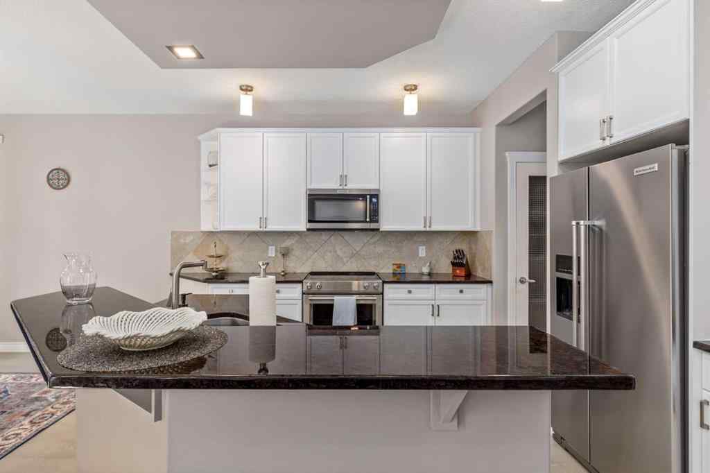 MLS® A2249604 - 12481 Crestmont Boulevard SW in Crestmont Calgary, Residential