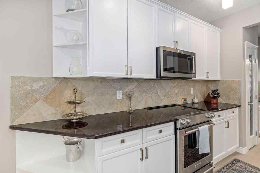 MLS® A2249604 - 12481 Crestmont Boulevard SW in Crestmont Calgary, Residential