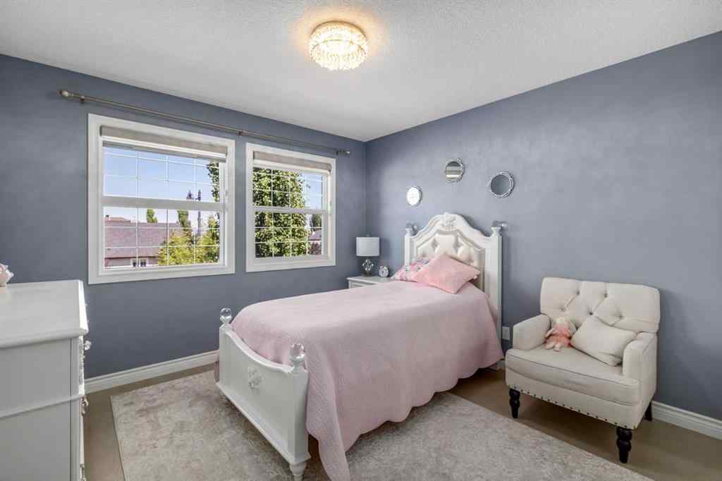 MLS® A2249604 - 12481 Crestmont Boulevard SW in Crestmont Calgary, Residential