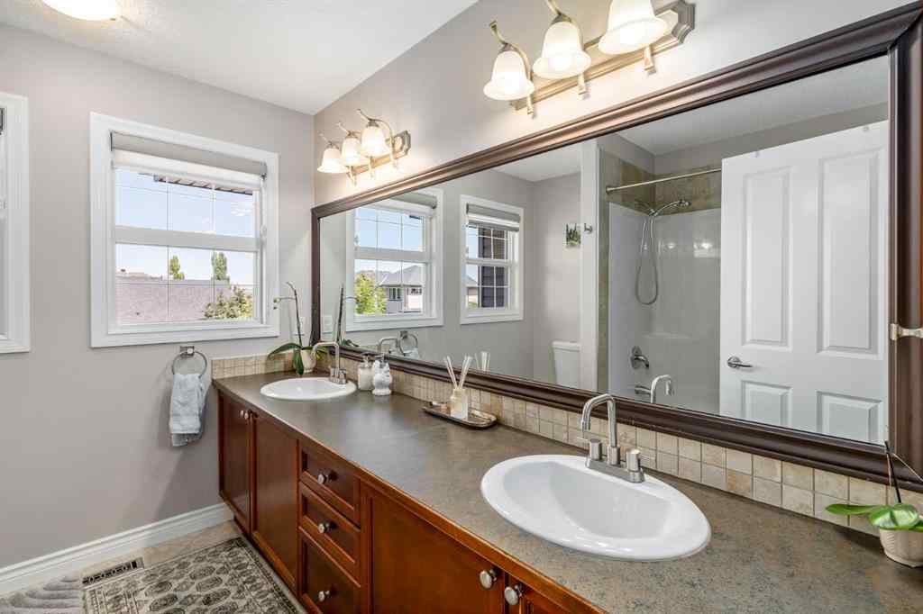 MLS® A2249604 - 12481 Crestmont Boulevard SW in Crestmont Calgary, Residential