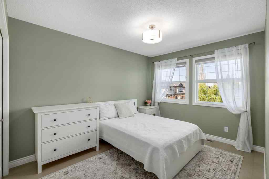 MLS® A2249604 - 12481 Crestmont Boulevard SW in Crestmont Calgary, Residential