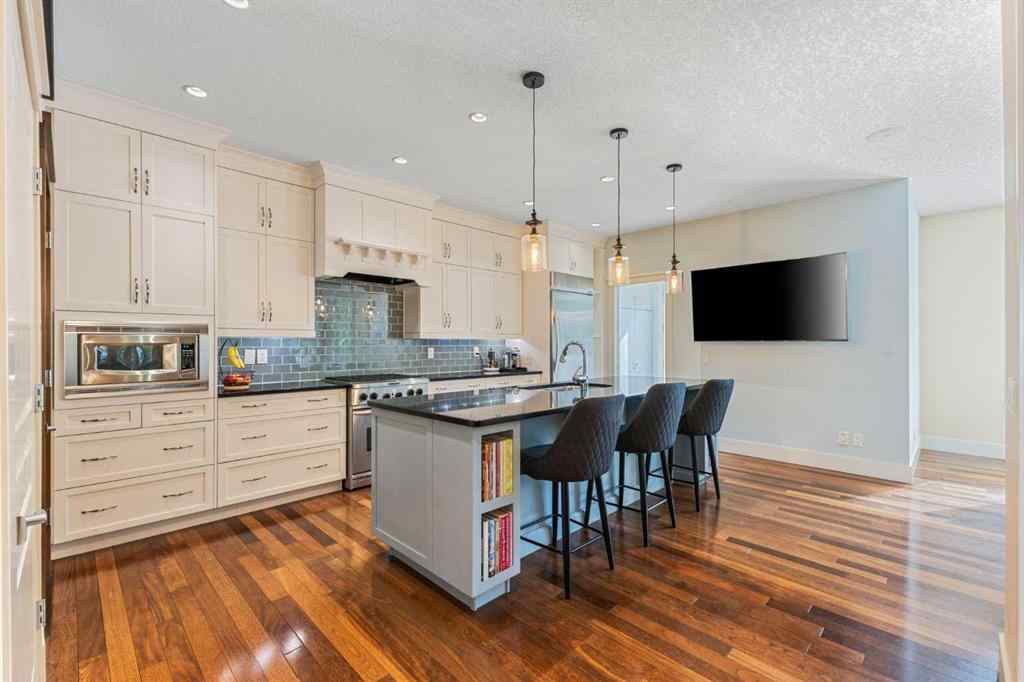 MLS® A2249671 - 5566 Henwood Street SW in Garrison Green Calgary, Residential