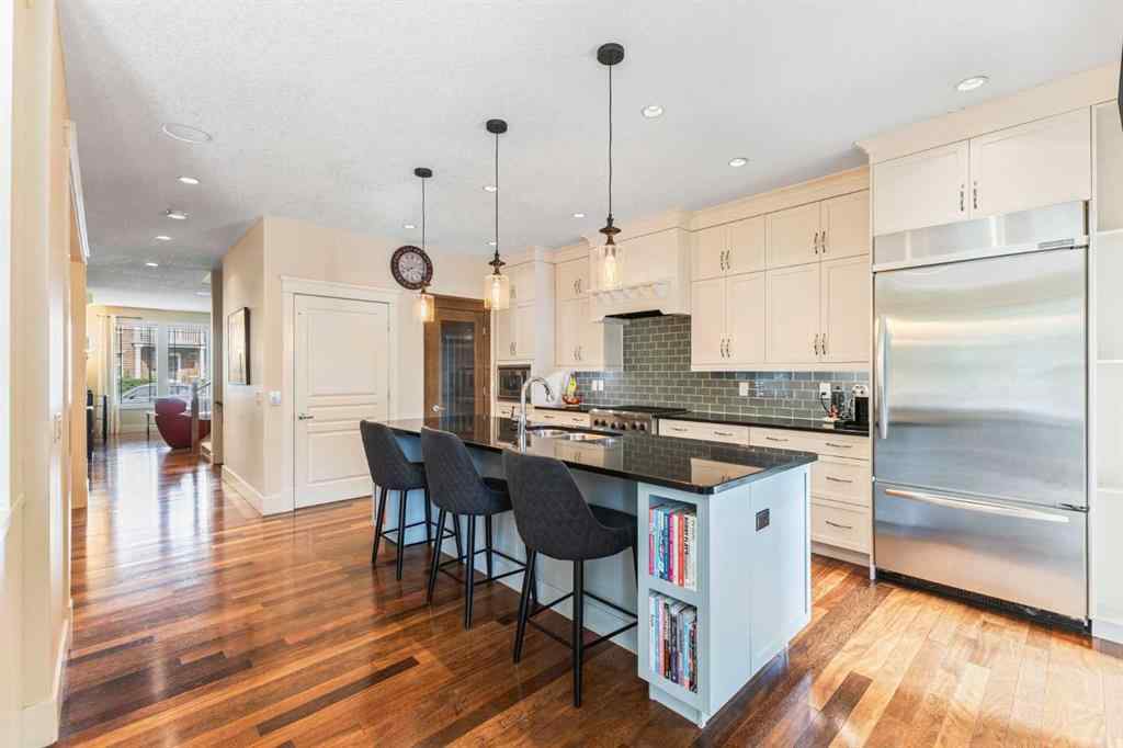 MLS® A2249671 - 5566 Henwood Street SW in Garrison Green Calgary, Residential