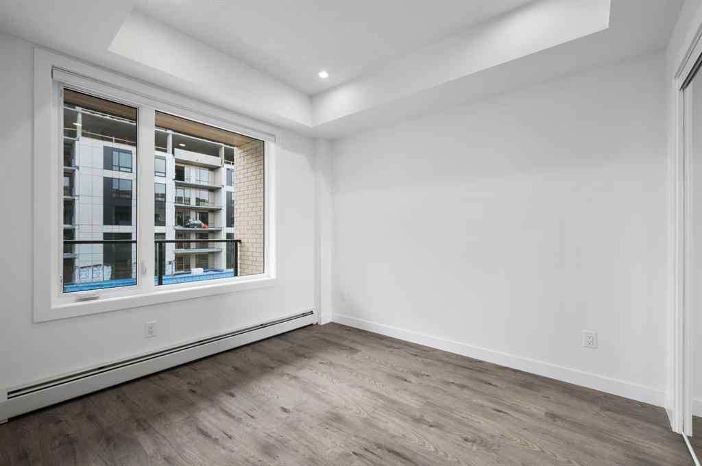 MLS® A2249981 - Unit #402 8370 Broadcast Avenue SW in West Springs Calgary, Residential