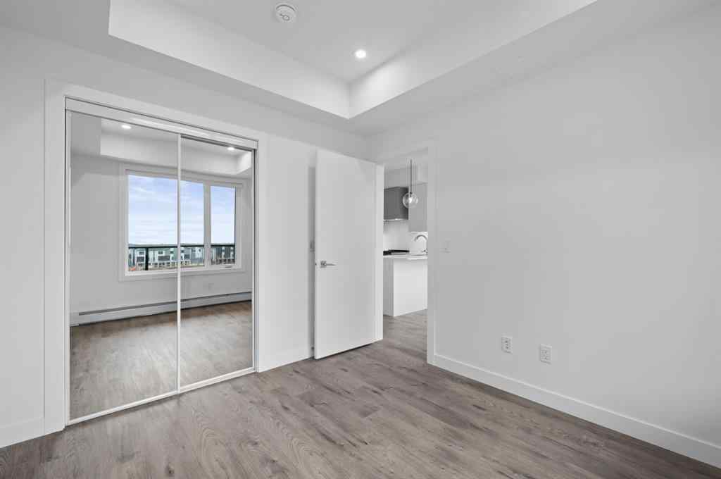 MLS® A2249981 - Unit #402 8370 Broadcast Avenue SW in West Springs Calgary, Residential