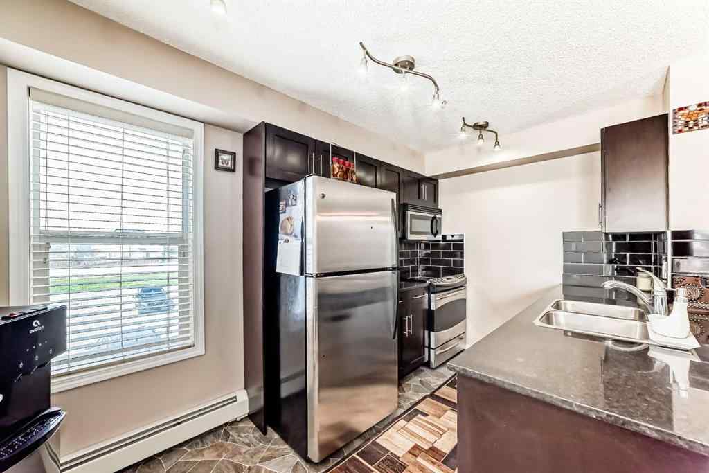 MLS® A2250022 - Unit #218 7130 80 Avenue NE in Saddle Ridge Calgary, Residential