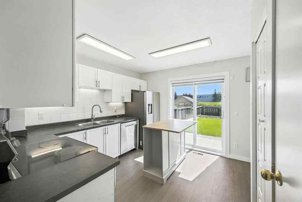 MLS® A2250067 - 99 Erin Road SE in Erin Woods Calgary, Residential