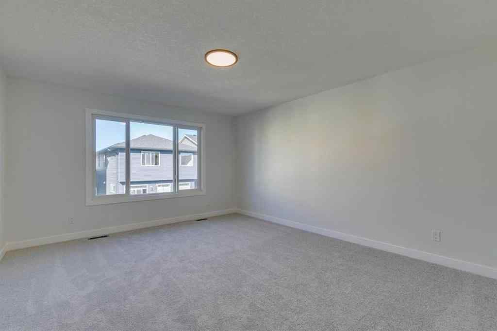 MLS® A2250164 - 60 Creekside Path SW in Pine Creek Calgary, Residential