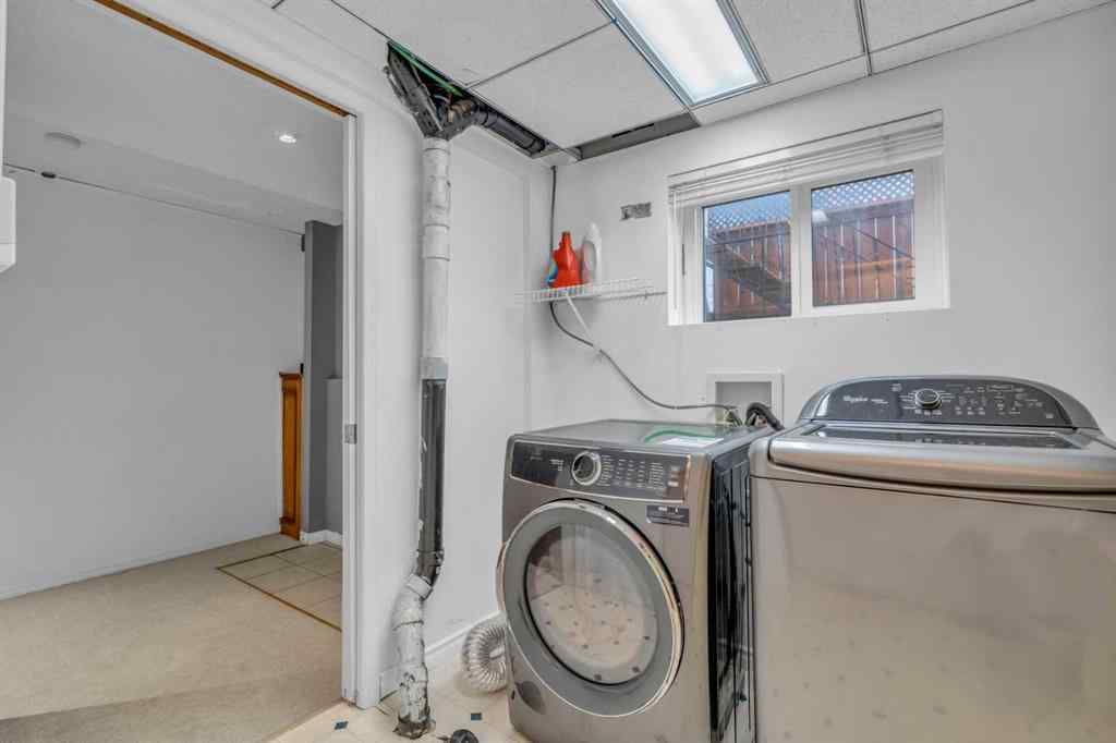 MLS® A2250254 - 403 Queen Alexandra Way SE in Queensland Calgary, Residential