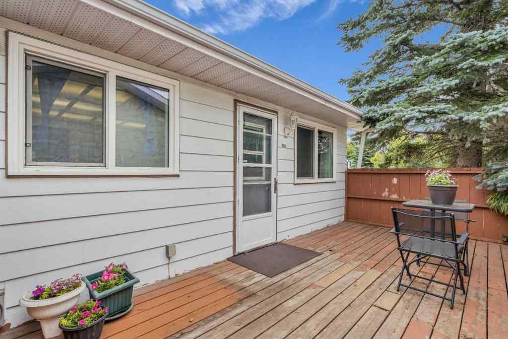 MLS® A2250254 - 403 Queen Alexandra Way SE in Queensland Calgary, Residential