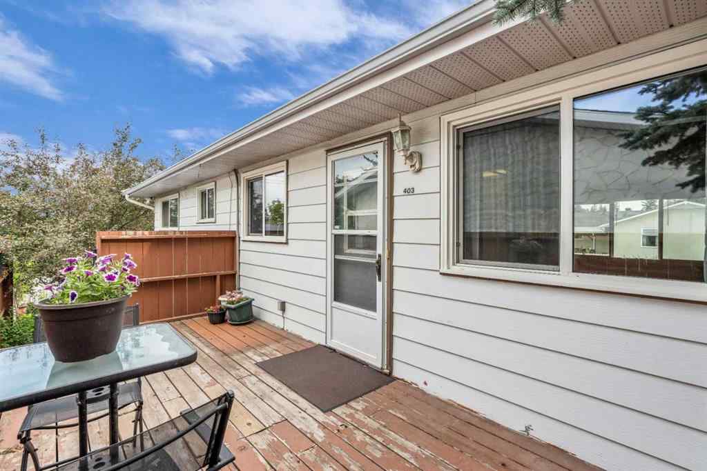 MLS® A2250254 - 403 Queen Alexandra Way SE in Queensland Calgary, Residential