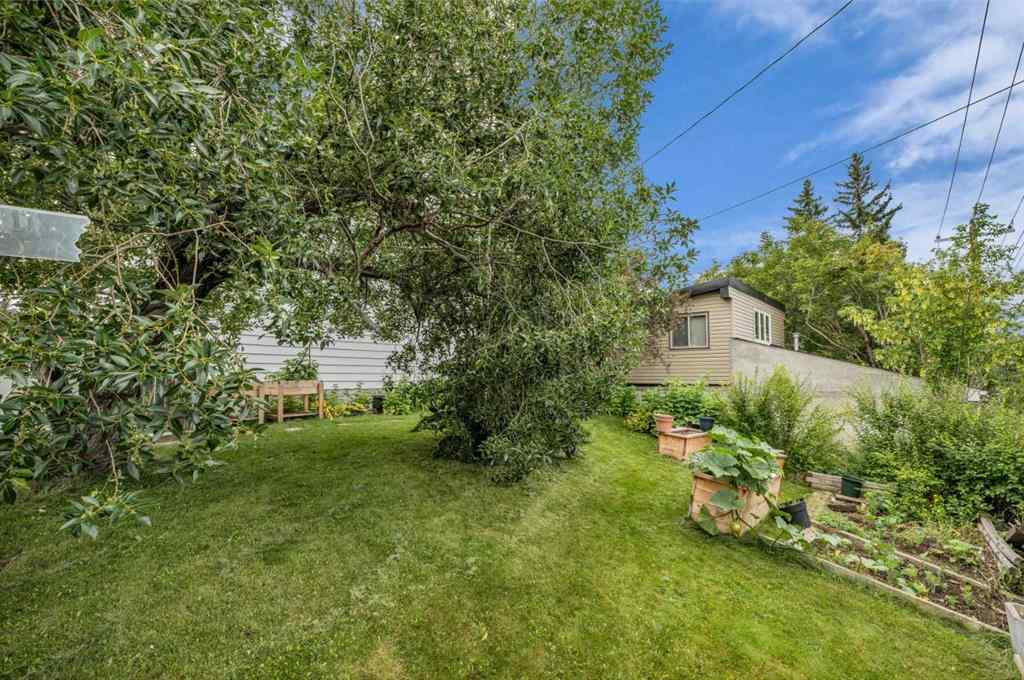 MLS® A2250254 - 403 Queen Alexandra Way SE in Queensland Calgary, Residential
