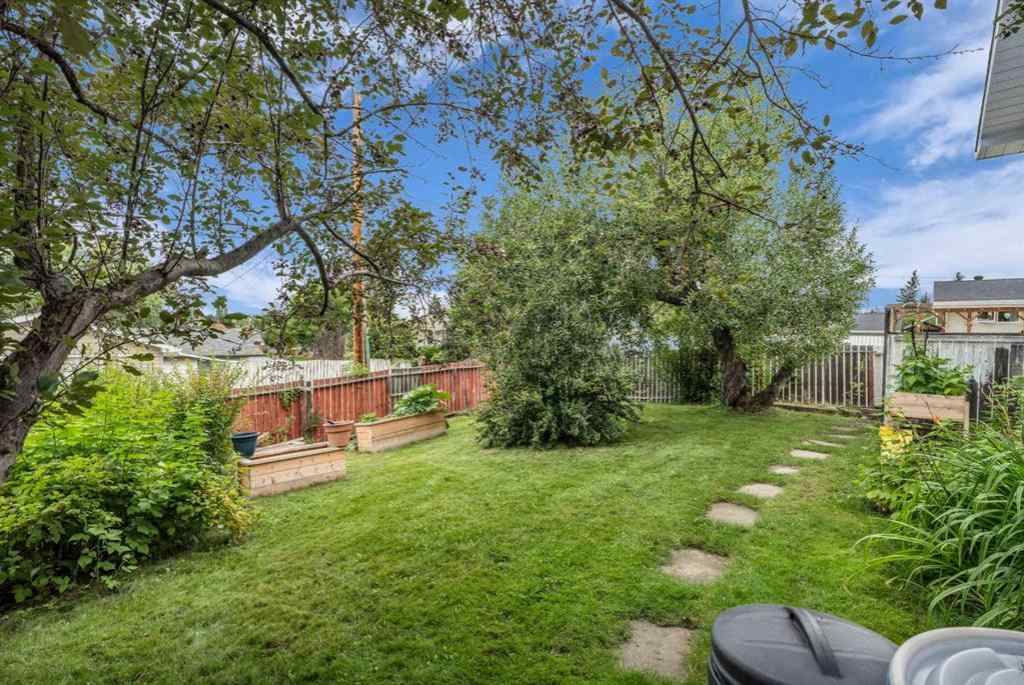MLS® A2250254 - 403 Queen Alexandra Way SE in Queensland Calgary, Residential