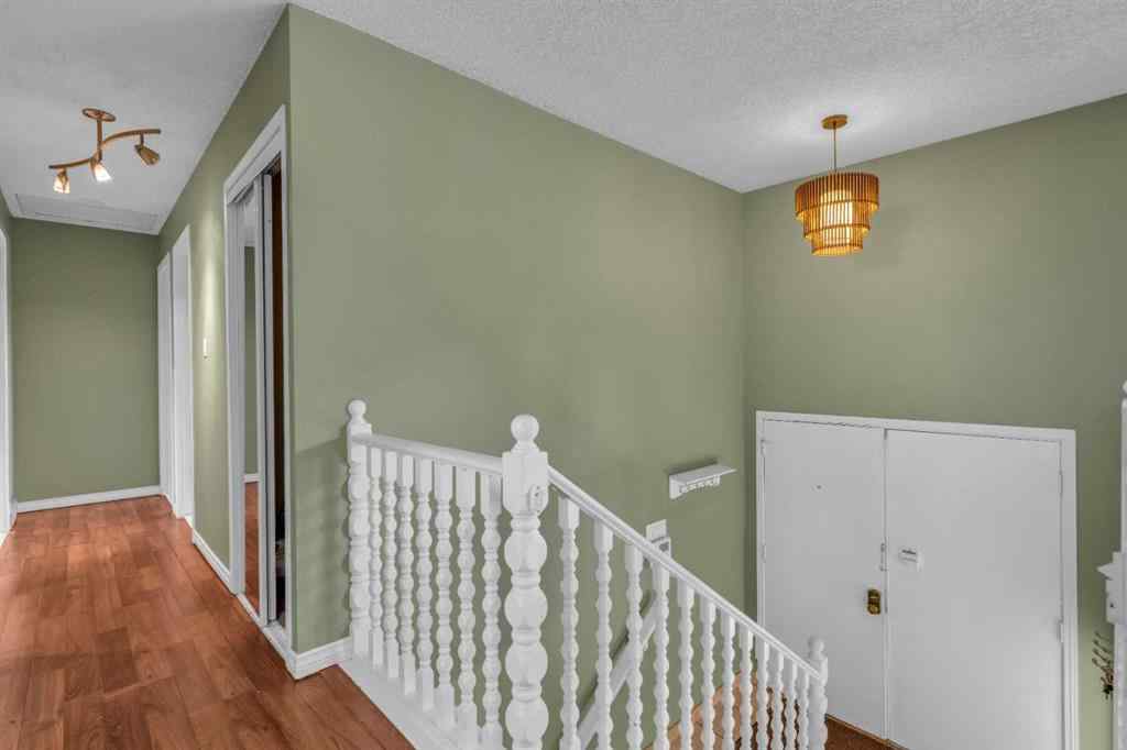 MLS® A2250254 - 403 Queen Alexandra Way SE in Queensland Calgary, Residential